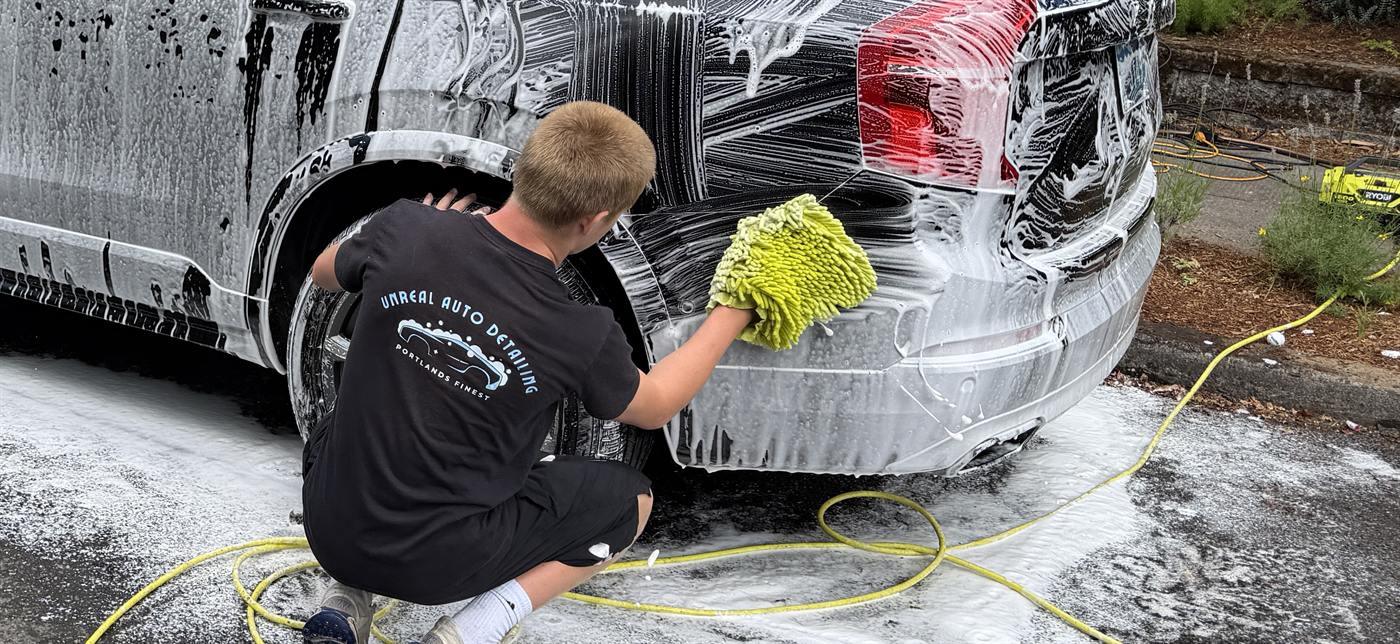 Close detail work on the lower body of an SUV